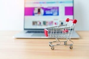 e-commerce, shopping cart with laptop